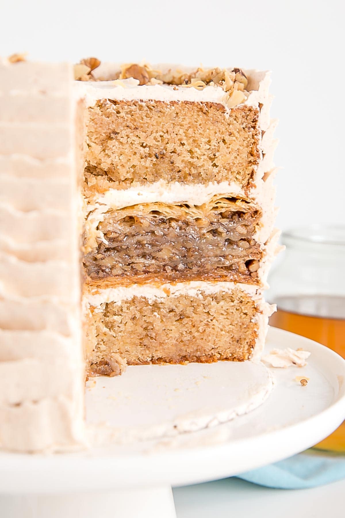 Inside shot of a baklava cake with honey walnut cake layers.