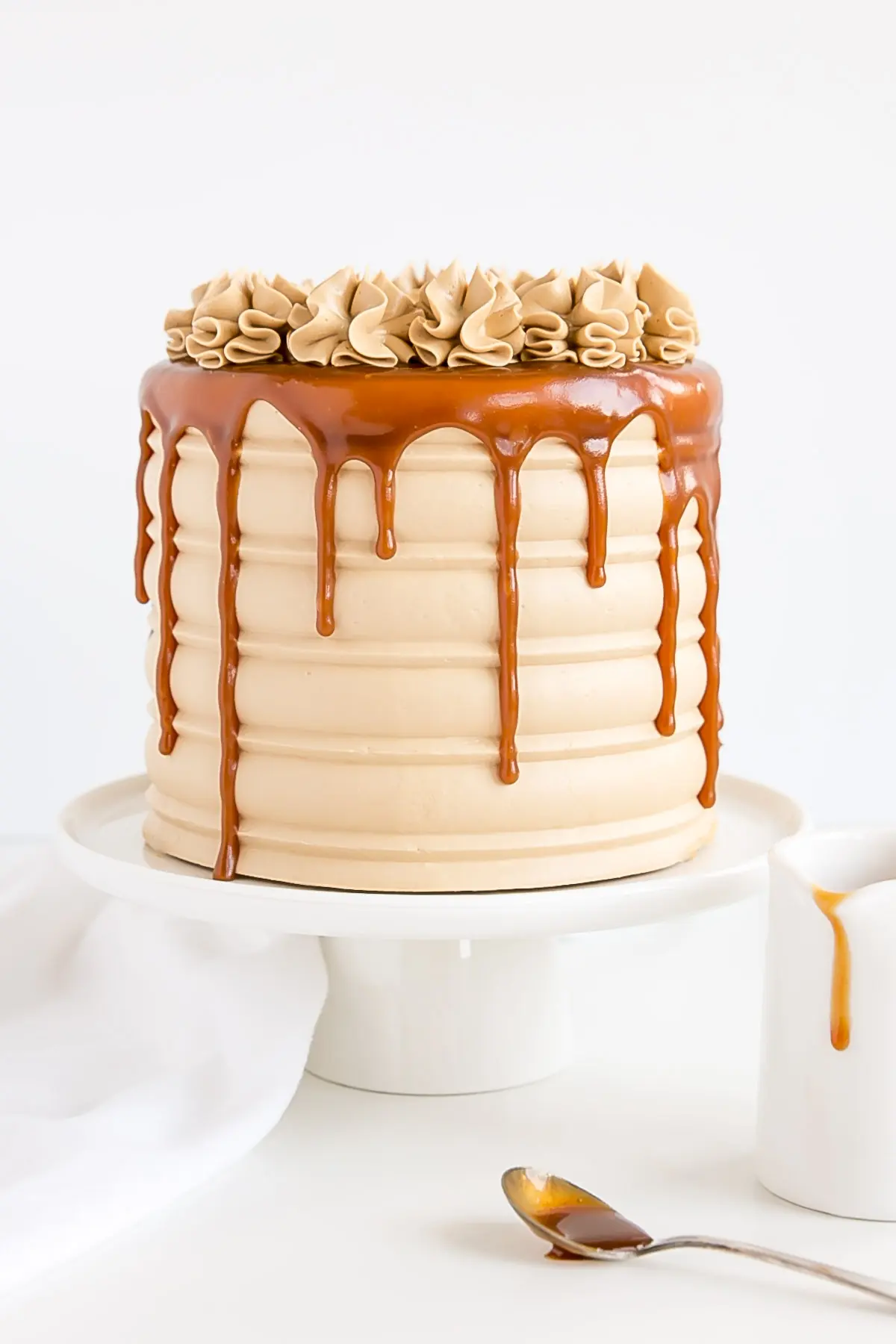 Caramel infused cake layers with a caramel buttercream and caramel drip.