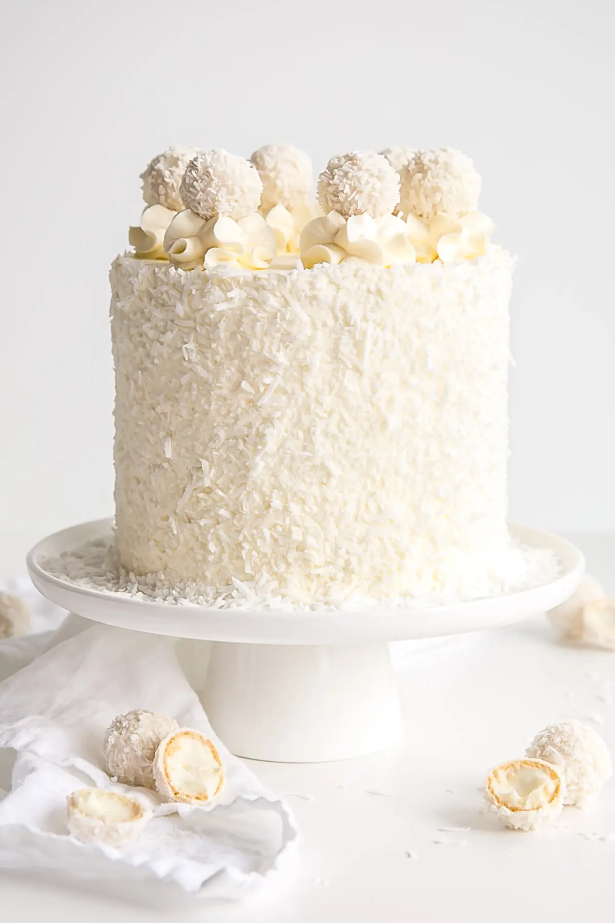 Coconut Almond Cake covered with shredded coconut.