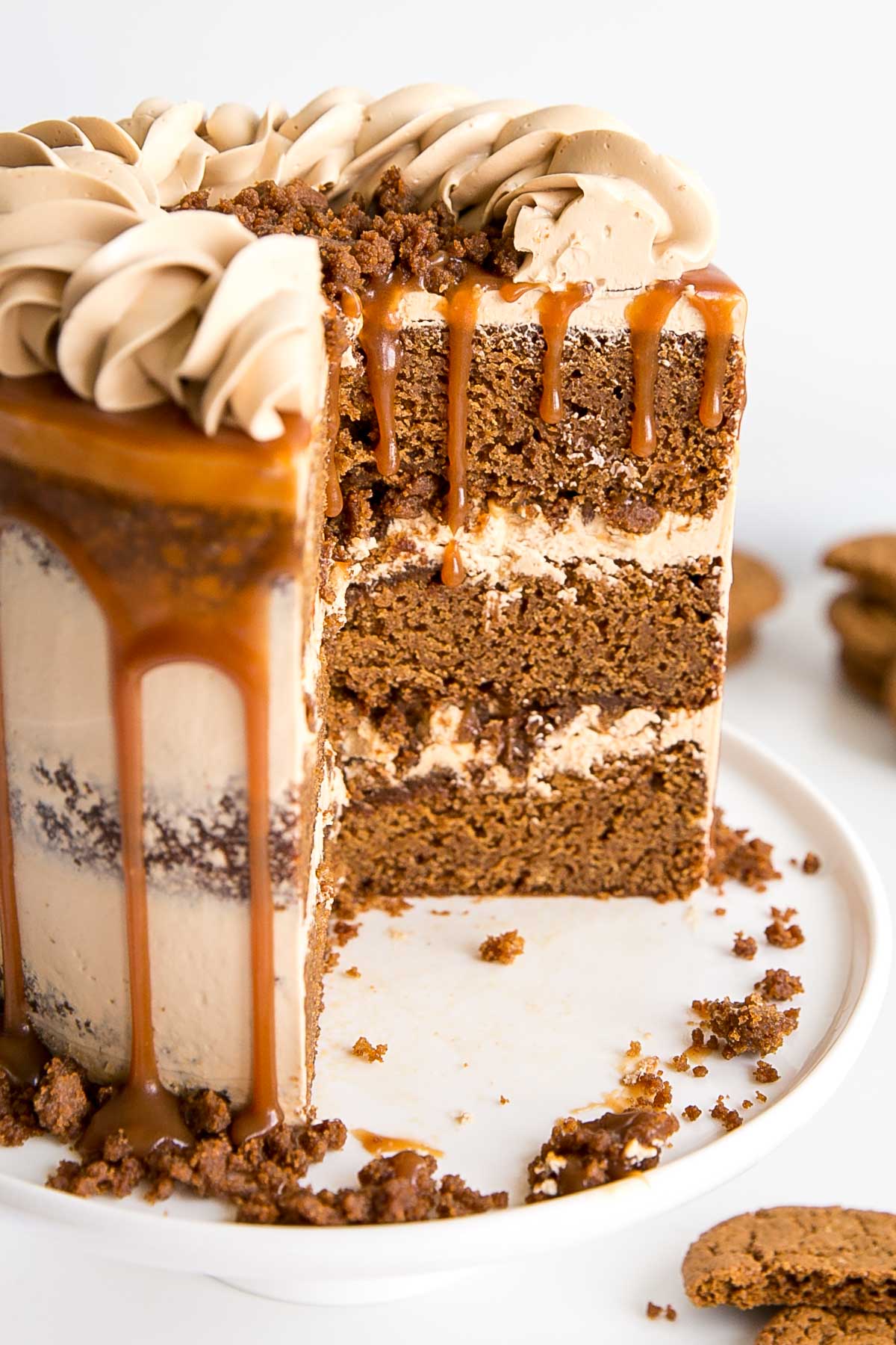 Cross section showing gingerbread cake layers, caramel buttercream and gingerbread streusel.