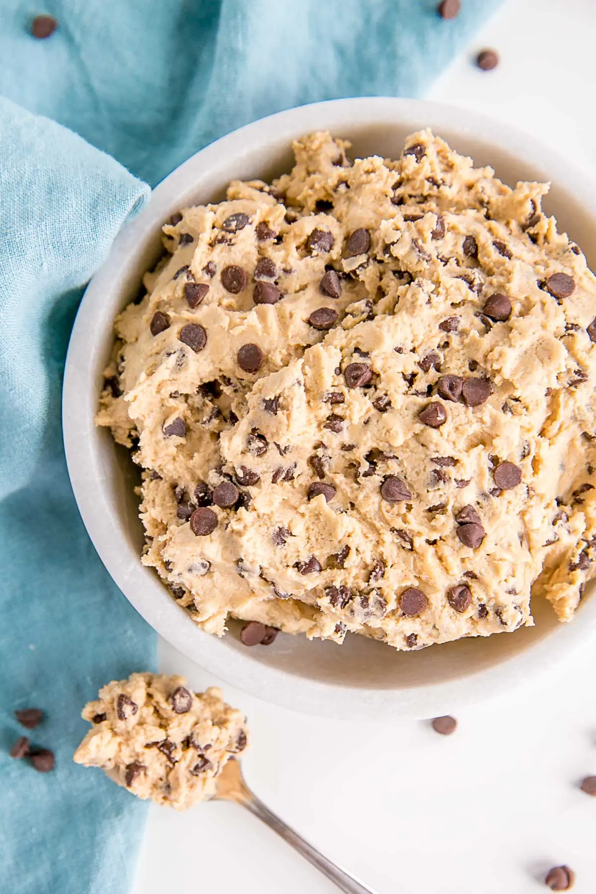 Overhead photo of cookie dough in a bowl and a spoonful of cookie dough on the side.