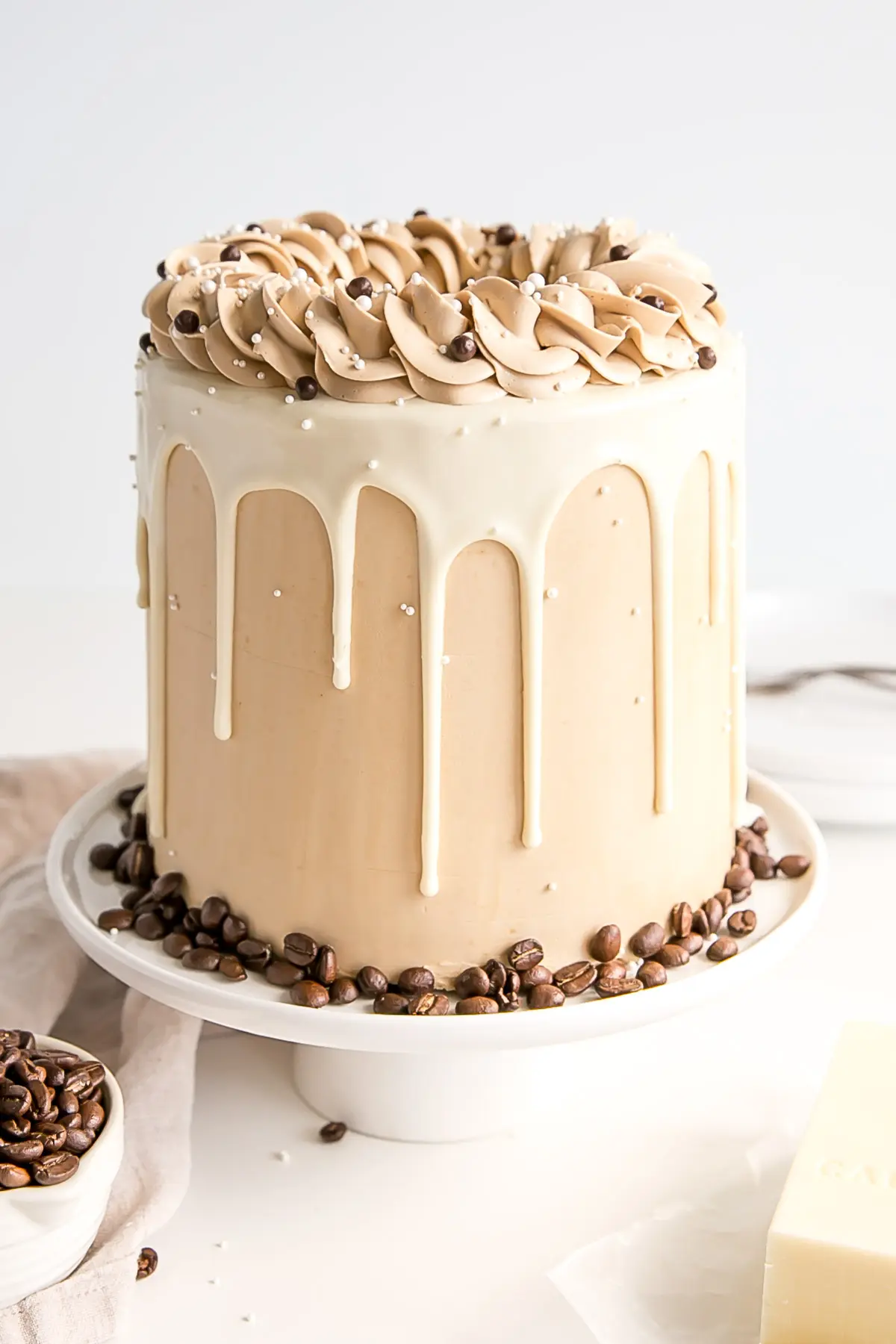 Cake with espresso buttercream and white chocolate drips.