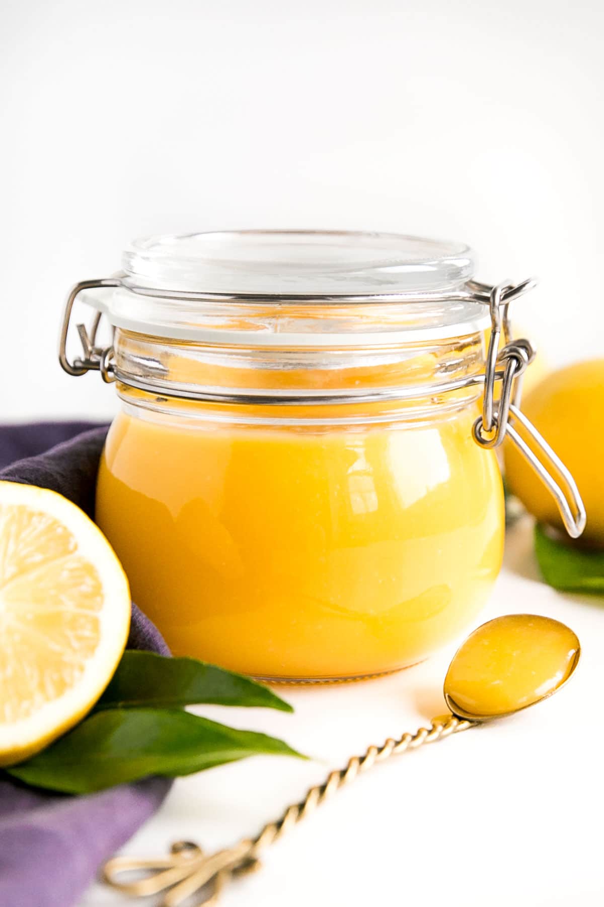 Lemon curd in a glass jar.