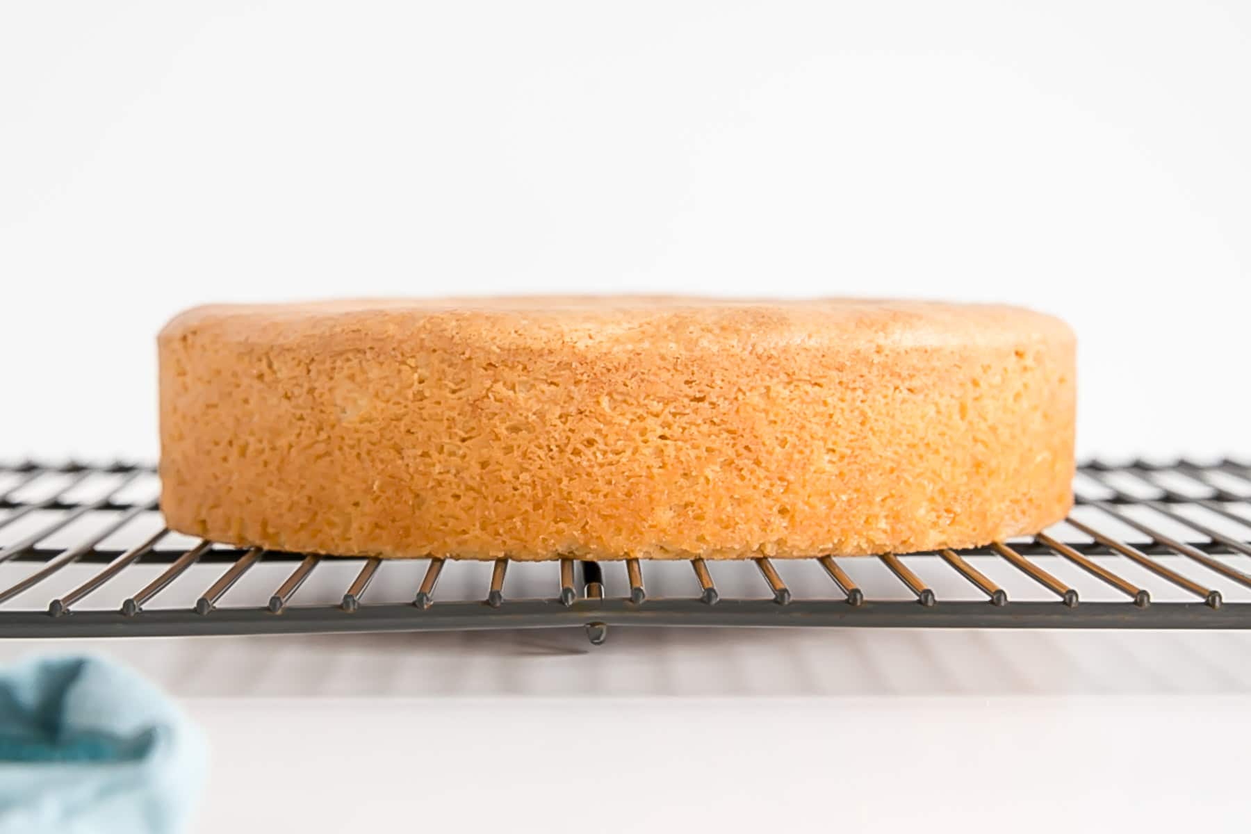 Perfectly flat cake on a cooling rack.