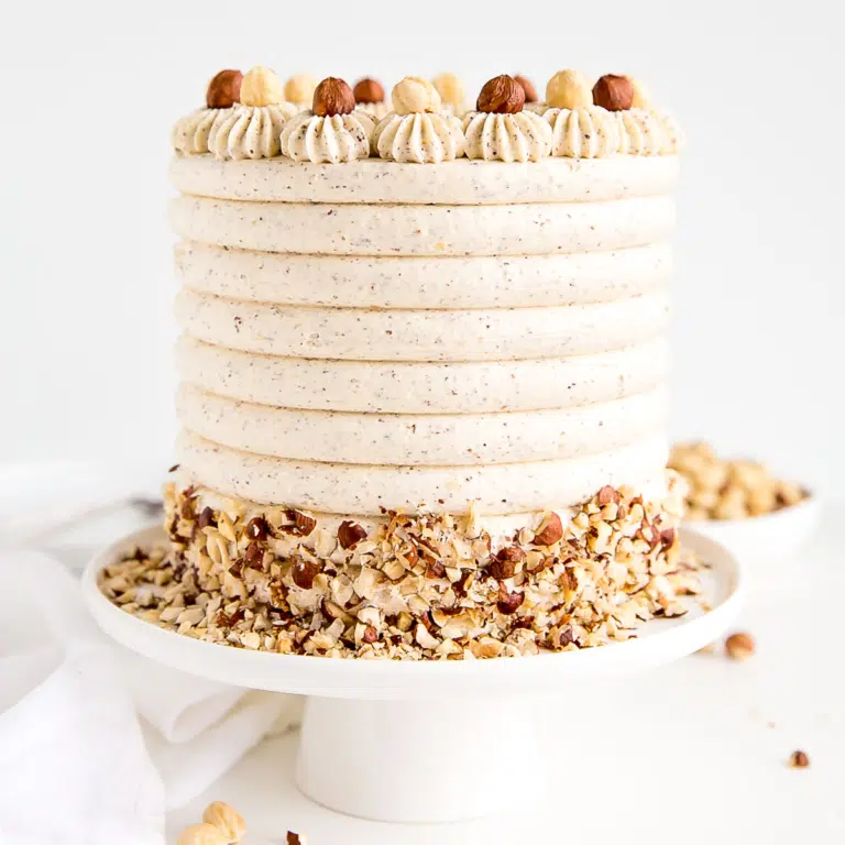 Cake on a white cake stand.