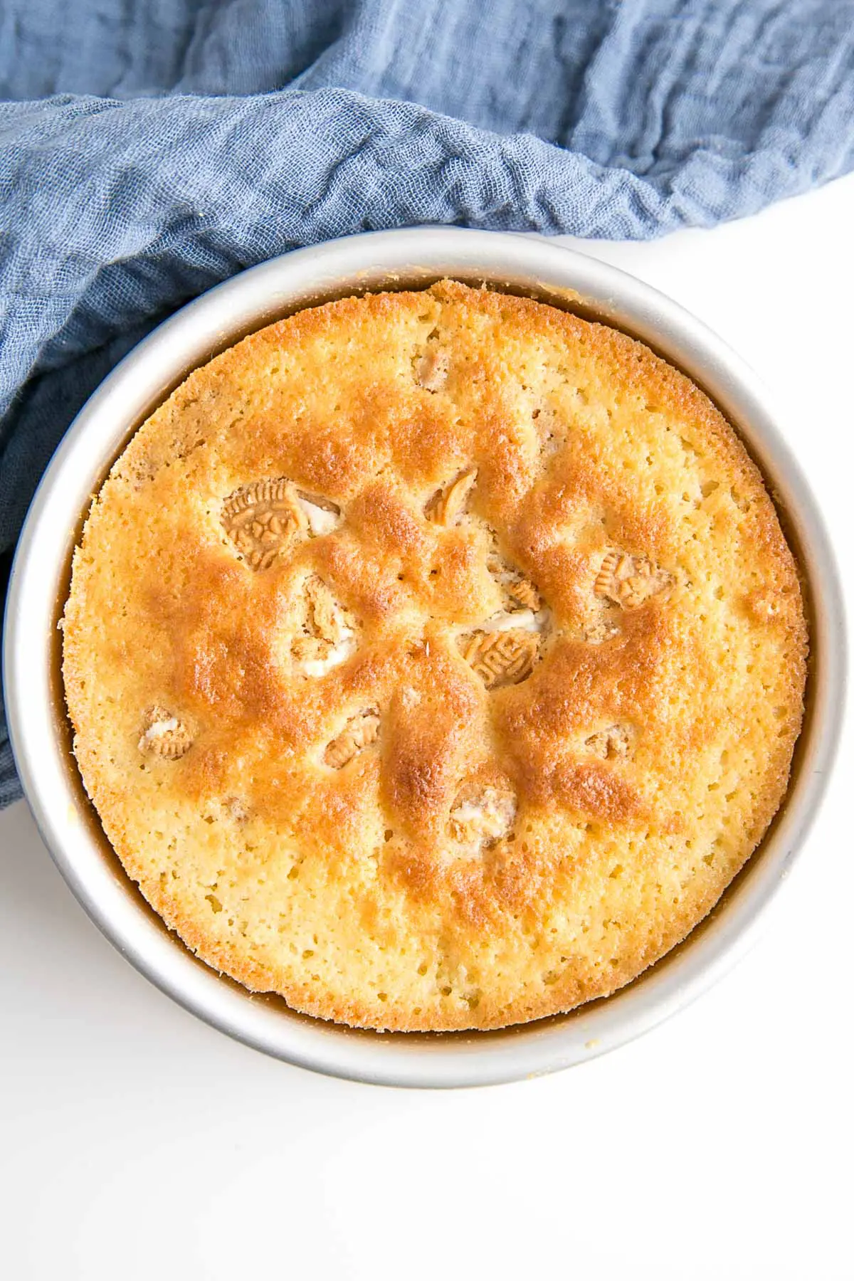 Baked cake in a cake pan.